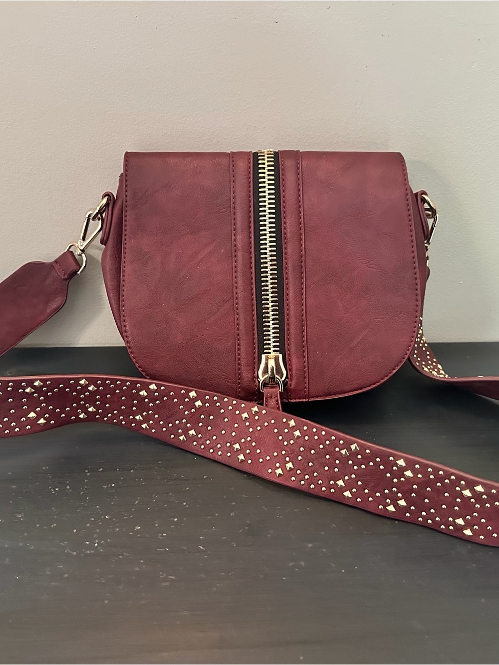 Madison West Studded Burgundy Crossbody Bag with Gold Zip Detail